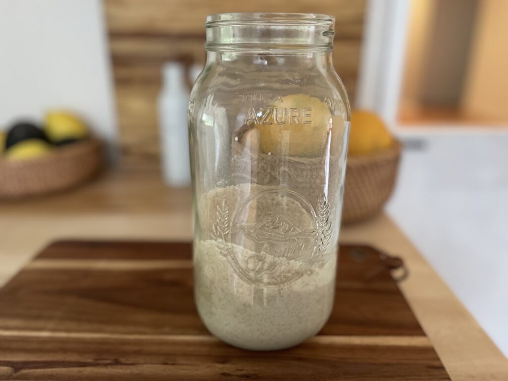 A half gallon glass jar of homemade sourdough starter