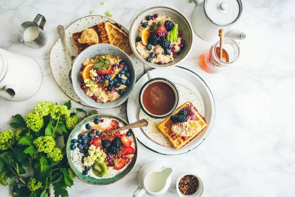 Image of weekly meal plan in action with a bountiful breakfast table.